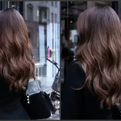 Vacker balayage ljust hår med mjuka vågor, perfekt för en stilfull vardag.