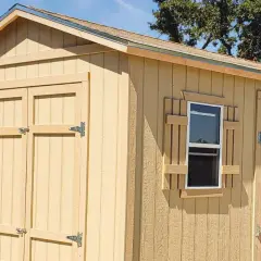 A newly built shed with double doors and a window. This shed is ready to build your dreams in.