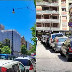 Parcheggio scambiatore Roma: auto in fila su strada urbana con edifici residenziali e un cantiere.