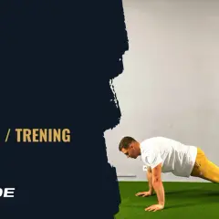 Mężczyzna wykonuje plank, ćwiczenie idealne dla początkujących. Na ekranie widnieje napis "PLANK TECHNIKA / TRENING".