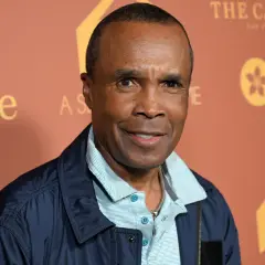 Sugar Ray Leonard, a boxing legend, smiles. His career earnings are a testament to his skill, though his net worth is a separate matter.