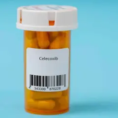 Orange pill bottle with a label reading "Celecoxib" and a barcode.