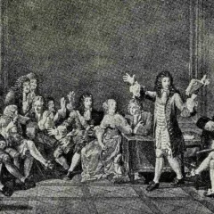 Grupa ludzi w strojach z epoki baroku, jeden mężczyzna przemawia, trzymając książkę.