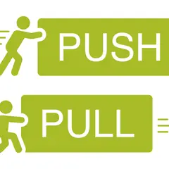 Zielona ikona z sylwetką człowieka pchającego (PUSH) i ciągnącego (PULL).
