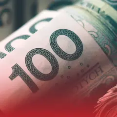 Zwijane banknoty 100 zł, symbolizujące zarobki, być może nawet najniższa krajowa na godzinę.