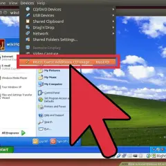 Wirtualna maszyna VirtualBox z systemem Windows XP. Kliknięcie "Insert Guest Additions CD image..." jest kluczowe.