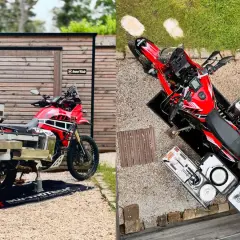 Una moto trail roja lista para la aventura, con maletas y equipo de camping.