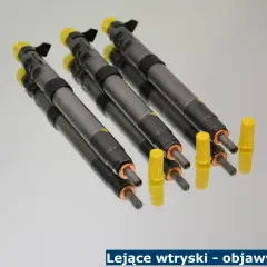 Kilka wtryskiwaczy Common Rail z żółtymi kapturkami, gotowych do montażu. Objawy lejących wtryskiwaczy diesel mogą być różne.