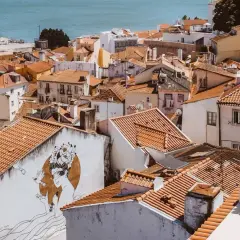 Alfama, Lisbon, is a charming, historic district with narrow streets and colorful buildings. It's generally considered safe for tourists.