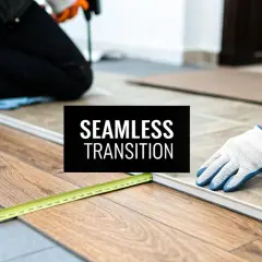 Workers install flooring, creating a seamless transition from tile to laminate. A measuring tape and drill are visible.