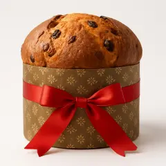 Panettone w ozdobnym pudełku z czerwoną wstążką. Idealny na prezent, a może to Twój panettone przepis?