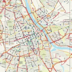 Mapa tras rowerowych Warszawy. Czerwone linie pokazują ścieżki rowerowe, a niebieskie punkty to stacje Veturilo.