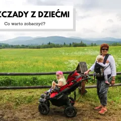Bieszczady z dziećmi: kobieta z dzieckiem w chuście i dziewczynka w wózku na tle łąki i gór.