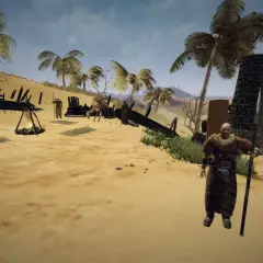 Pustynny obóz w grze Gothic 3, ulepszony przez mody. Postać z włócznią i namioty na piasku.