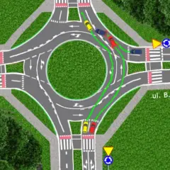 Schemat rondo turbinowe: zielone linie pokazują prawidłowy tor jazdy dla samochodów, które wjeżdżają na rondo i chcą skręcić w prawo.