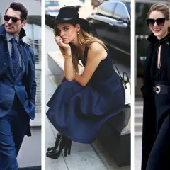 Uomo in abito blu, donna con cappello e gonna blu, donna con cappotto nero. Blu e nero stanno bene insieme, creando un look elegante e sofisticato.