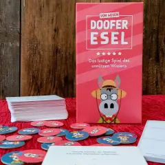 Gesellschaftsspiele für 6 Personen: "Doofere Esel" – das lustige Spiel des unnützen Wissens mit vielen runden Spielkarten.