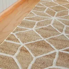 A natural fiber hallway runner with a geometric pattern. This image prompts the question: how long should a hallway runner be to perfectly fit your space?