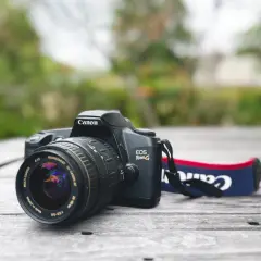 Canon EOS Rebel G film camera with a Quantaray 28-90mm lens, a classic choice for the best Canon 35mm film camera experience.