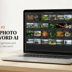Laptop displaying ON1 Photo Keyword AI, a free AI photo organizer, showcasing a grid of travel photos.
