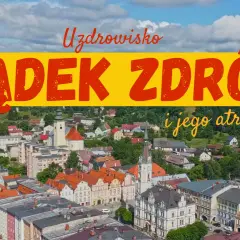 Uzdrowisko Lądek-Zdrój i jego atrakcje. Widok z lotu ptaka na urokliwe miasteczko z kolorowymi kamienicami i zielonymi wzgórzami w tle.