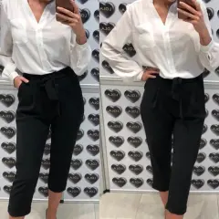 Co ubrać do czarnych eleganckich spodni? 7 stylowych propozycji