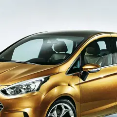 Złoty Ford B-Max z czarnym dachem, prezentujący nowoczesny design i przestronne wnętrze.
