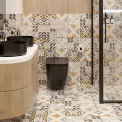 Mała łazienka w stylu hiszpańskim z czarnymi umywalkami, czarną toaletą i kolorowymi geometrycznymi płytkami.