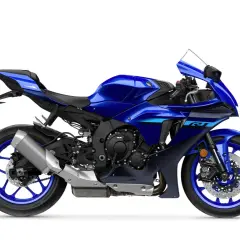 Niebieski motocykl sportowy Yamaha R1 2015 z ostrymi liniami i agresywnym wyglądem, gotowy na tor.