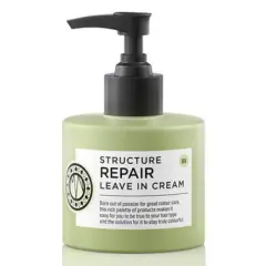 En ljusgrön flaska med pumpdispenser, märkning "Structure Repair Leave In Cream" för torrt hår.