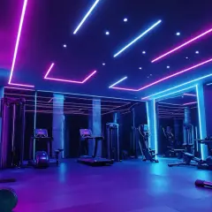 Nowoczesne oświetlenie sali gimnastycznej w neonowych barwach różu i błękitu tworzy futurystyczną atmosferę.