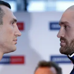 Two boxers, Vladimir Klitschko and Tyson Fury, face off before their fight.