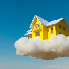 Una casa amarilla flotando en una nube, como si fuera un sueño con el interior de una casa perfecta.