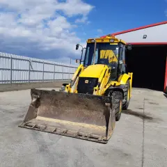 Koparko-ładowarka: Ile waży Twoja maszyna? Waga, transport, stabilność.