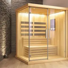 Une cabine de sauna moderne en bois et verre, idéale pour se détendre. Combien de sauna par semaine pour un bien-être optimal ?