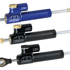 Tre ammortizzatori Hyperpro CSC, uno blu e due neri, perfetti per migliorare la stabilità delle Harley Davidson.