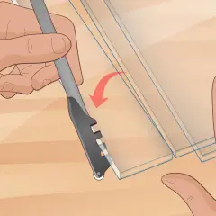 Hands demonstrate how to cut glass with a scoring tool, creating a clean line on the material.