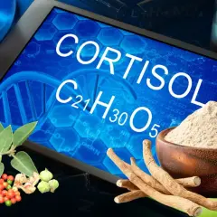 Ashwagandha i kortyzol. Na ekranie tabletka z napisem "CORTISOL", obok korzenie i proszek ashwagandhy.
