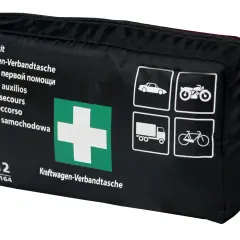 Czarna torba z apteczką samochodową, zielonym krzyżem i ikonami pojazdów.