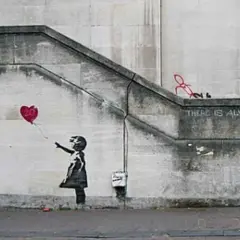 Banksy art piece: Girl letting go of a red heart balloon, with the words "THERE IS ALWAYS HOPE" stenciled above.