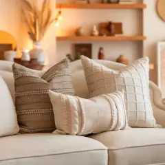 A cozy couch styled with textured pillows, showcasing how to style pillows on a couch for a warm, inviting look.