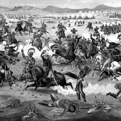Bitwa na równinach, gdzie **dakota wśród Indian** walczy z żołnierzami. Widać chaos, konie i dym.