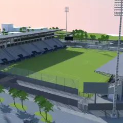 Nowoczesny stadion Sandecji z zieloną murawą, trybunami i oświetleniem.