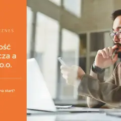 Mężczyzna z brodą i okularami zastanawia się nad założeniem spółki z o.o. i działalnością gospodarczą.