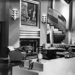 A luxurious Art Deco living room, showcasing the bold geometric style of the era's artists.