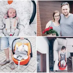 Szczęśliwy wyjście ze szpitala z noworodkiem. Rodzice z bukietem róż i maleństwem w foteliku samochodowym.