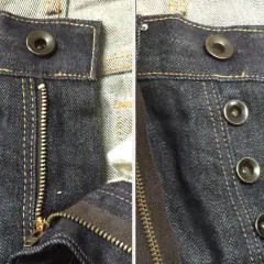 Close-up of dark wash jeans. One side shows a zipper fly with a single bouton jeans at the top. The other side displays three bouton jeans.