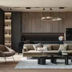 Nowoczesny salon z kuchnią, gdzie polski producent oświetlenia podkreśla elegancję wnętrza.