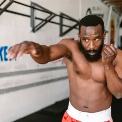 A man practices shadow boxing, demonstrating the physical and mental shadow boxing benefits.
