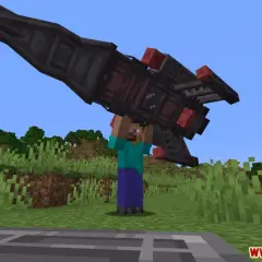 Steve z Minecrafta podnosi rakietę z modu ad astra.
